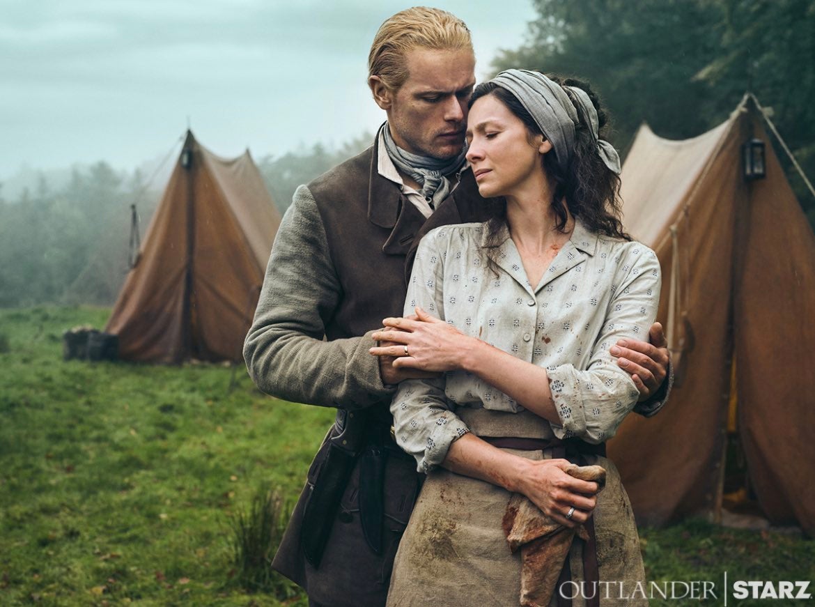 Promotional photo featuring a man and a woman in period wear