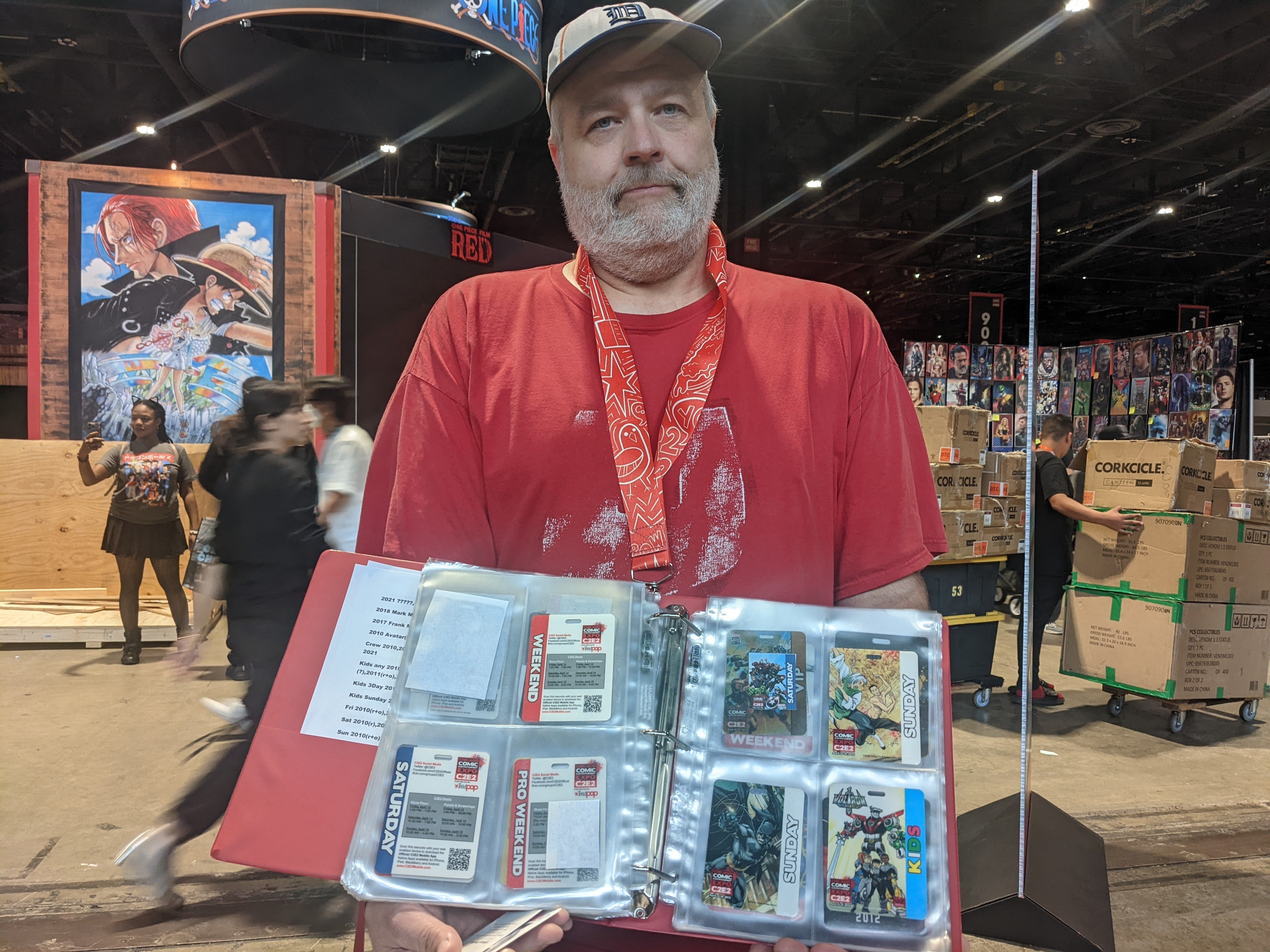 Tim Allison holding his binder up