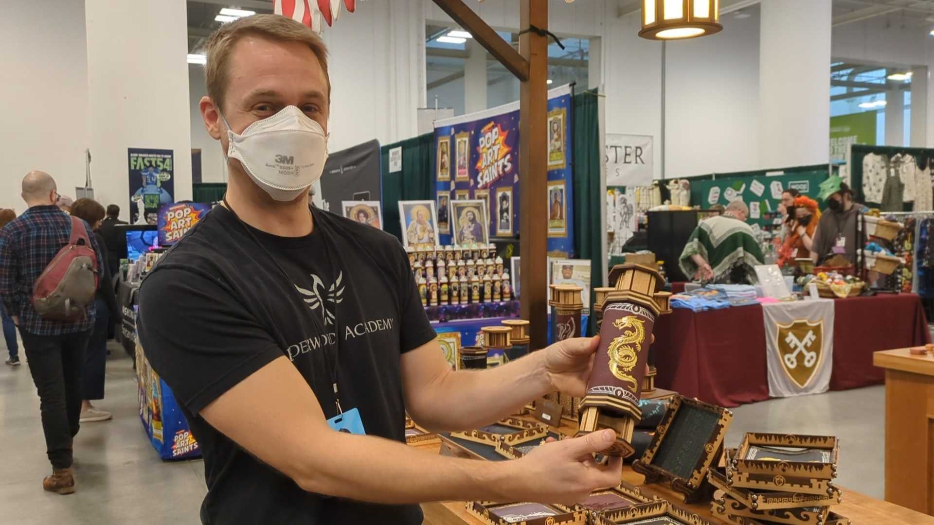 Quentin Weir holding a Codex at his booth