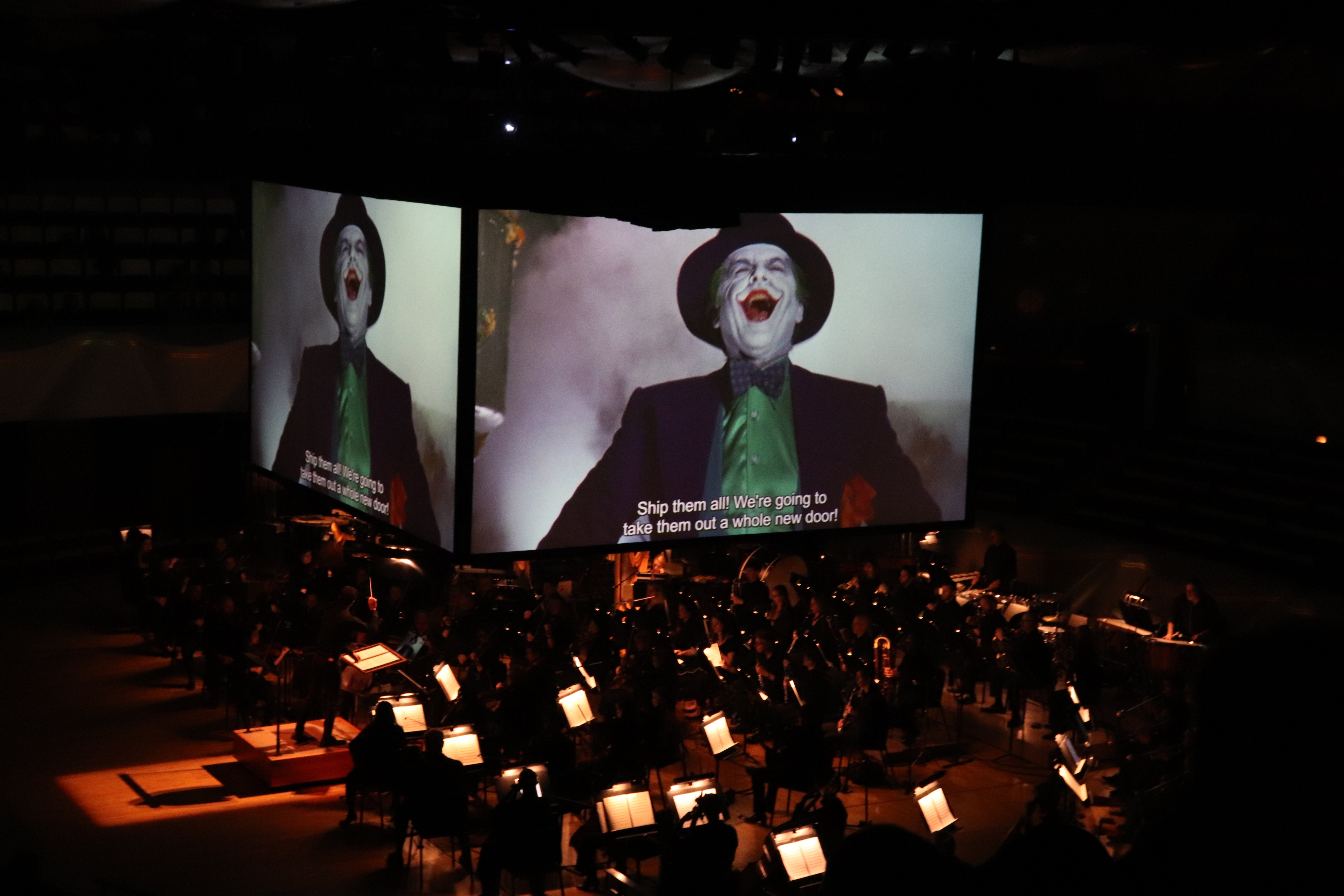 Photograph of Batman concert featuring on stage screens and orchestra